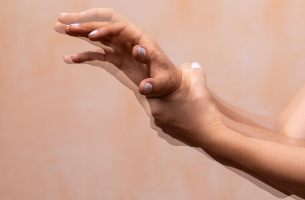 A close-up of shaking hands of a person suffering from Parkinson's disease.